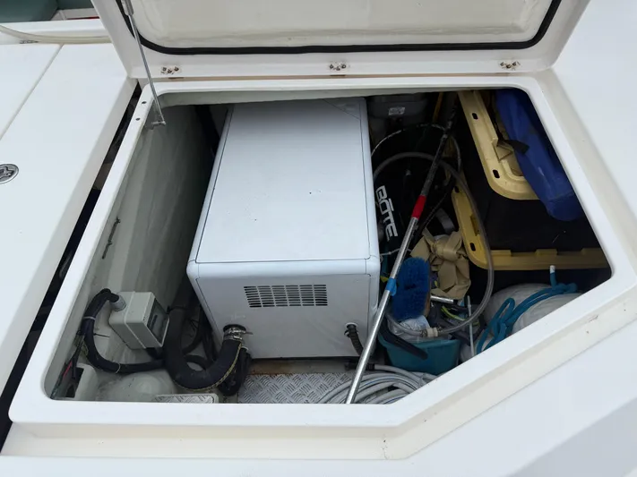 White Wings Yacht Photos Pics Storage compartment on a 2013 Leopard 48 yacht, containing equipment and supplies.