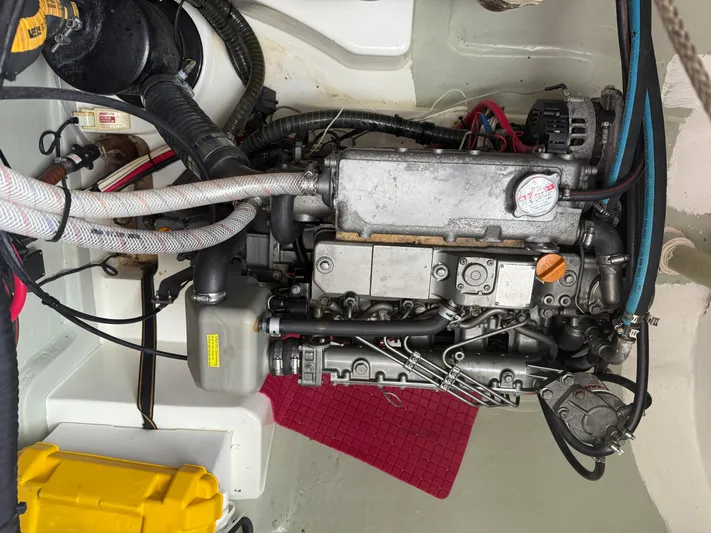 White Wings Yacht Photos Pics Engine compartment of a 2013 Leopard 48 yacht, showcasing mechanical components and wiring.