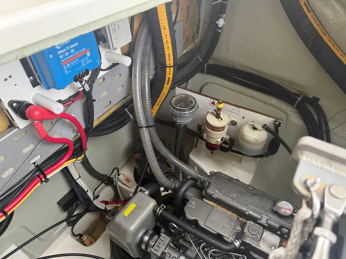 White Wings Yacht Photos Pics Engine compartment of a 2013 Leopard 48 yacht, featuring wiring and components.