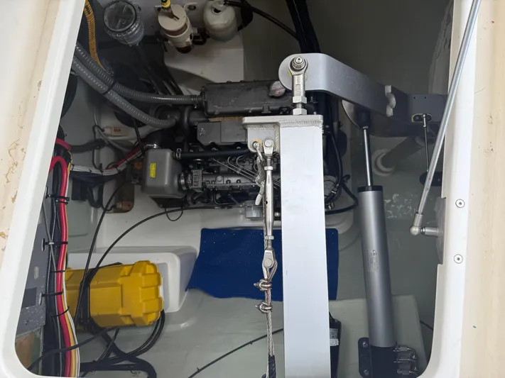 White Wings Yacht Photos Pics Engine compartment of a 2013 Leopard 48 yacht, showcasing mechanical components and wiring.