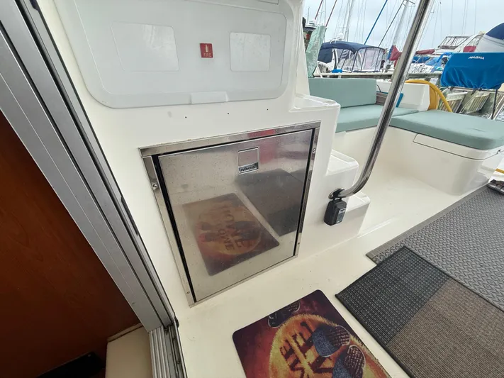 White Wings Yacht Photos Pics Interior of a 2013 Leopard 48 yacht with seating and storage.