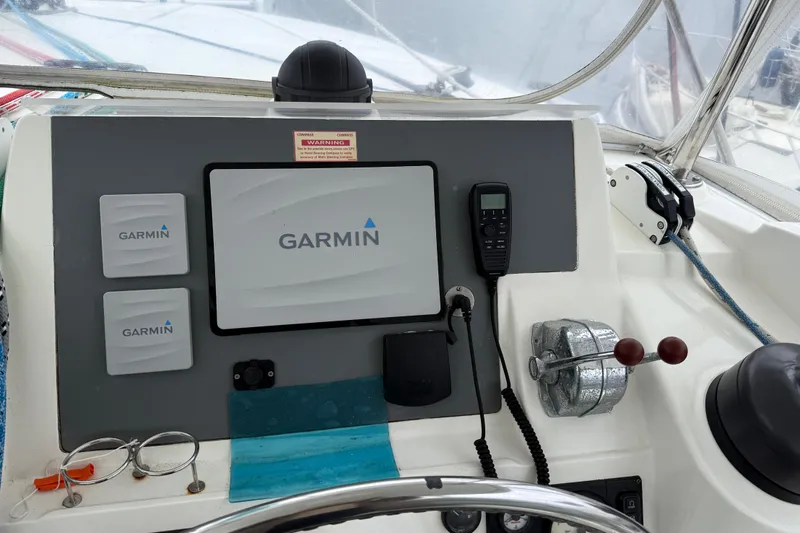White Wings Yacht Photos Pics Control panel of a 2013 Leopard 48 yacht featuring Garmin navigation equipment.
