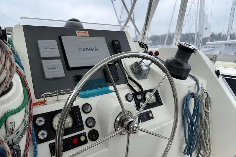 White Wings Yacht Photos Pics Steering wheel and Garmin navigation on 2013 Leopard 48 yacht cockpit.