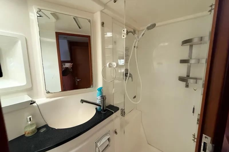 White Wings Yacht Photos Pics Bathroom interior of 2013 Leopard 48 yacht with shower and sink.