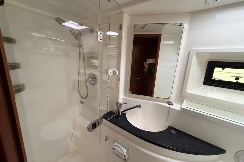 White Wings Yacht Photos Pics Modern bathroom in 2013 Leopard 48 yacht with shower and sleek sink design.
