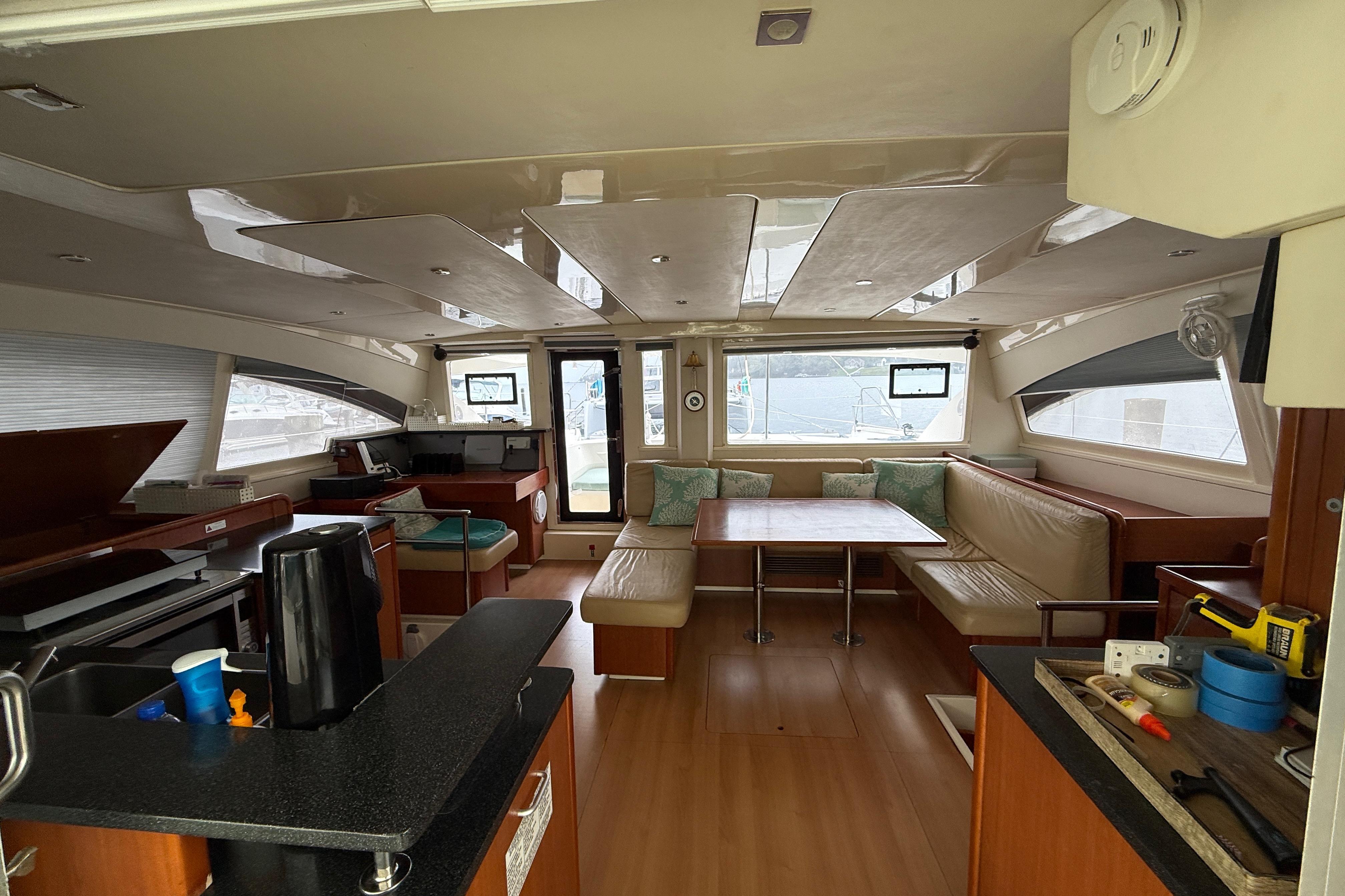 Luxurious interior of 2013 Leopard 48 yacht with spacious seating and modern amenities.