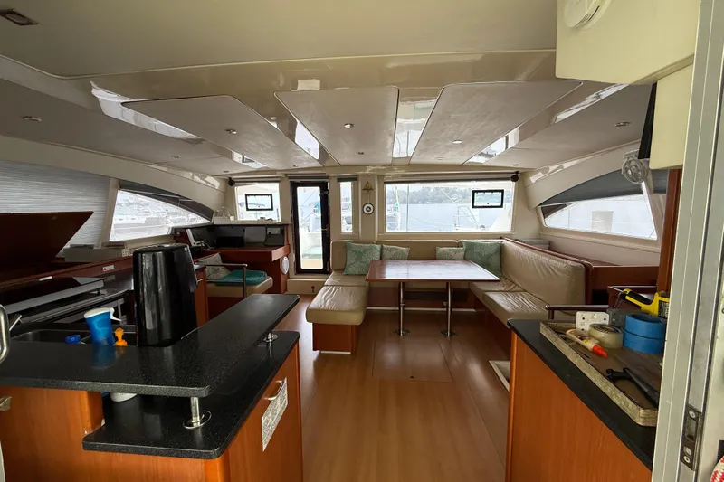 White Wings Yacht Photos Pics Interior of 2013 Leopard 48 yacht with modern kitchen and spacious seating area.