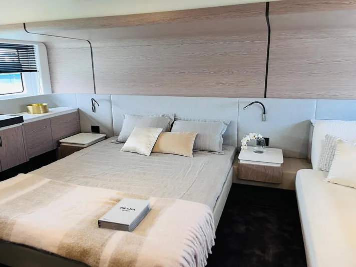  Yacht Photos Pics Luxurious bedroom interior of 2023 Azimut Fly 53 yacht with modern design and cozy bedding.