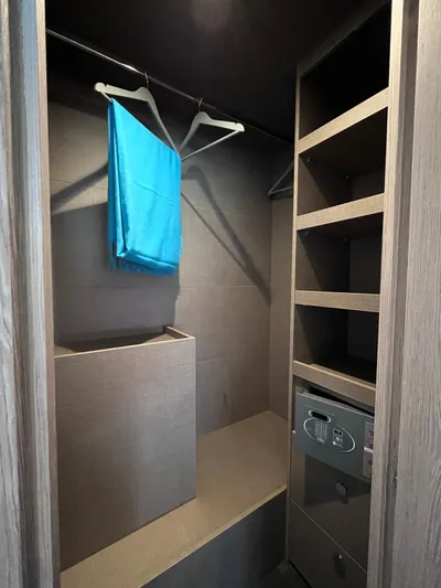  Yacht Photos Pics 2023 Azimut Fly 53 yacht closet with shelves, safe, and hangers.