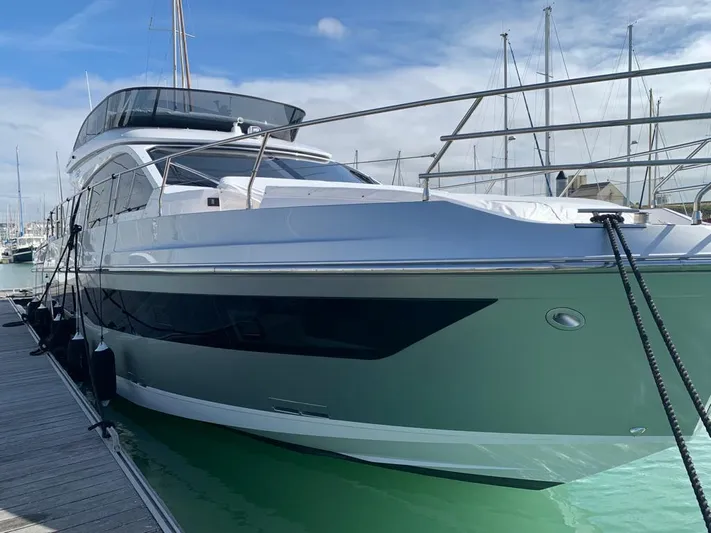  Yacht Photos Pics 2023 Azimut Fly 53 yacht docked at marina, showcasing sleek design and modern features.