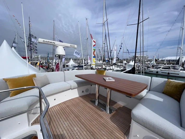  Yacht Photos Pics 2023 Azimut Fly 53 yacht deck with seating and table at marina.