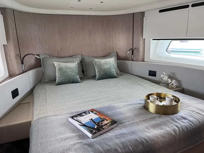  Yacht Photos Pics Luxurious bedroom interior of 2023 Azimut Fly 53 yacht with elegant decor and natural light.