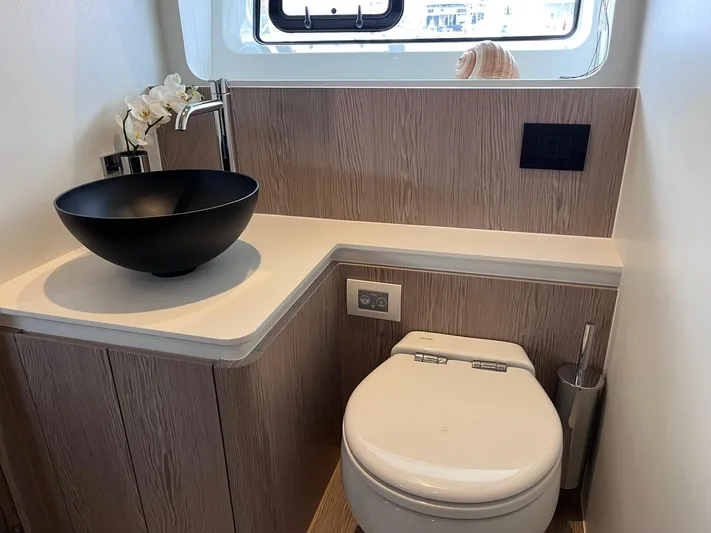  Yacht Photos Pics Luxurious bathroom in 2023 Azimut Fly 53 yacht with modern fixtures and elegant design.