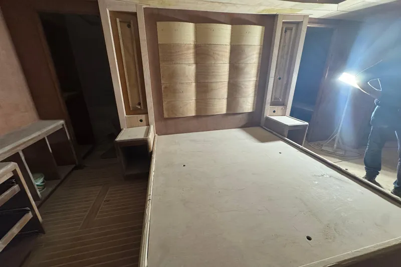 Opportunity Yacht Photos Pics Modern wooden interior of Artemis 100, 2026 model, under construction with ambient lighting.