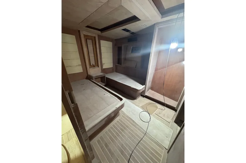 Opportunity Yacht Photos Pics Interior of 2026 Artemis 100 yacht under construction, featuring unfinished wooden design elements.