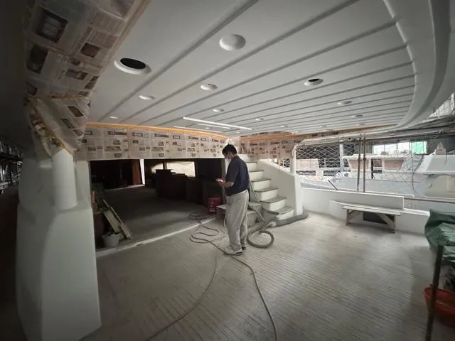 Opportunity Yacht Photos Pics Interior construction of Artemis 100 yacht, 2026 model, with worker and tools.