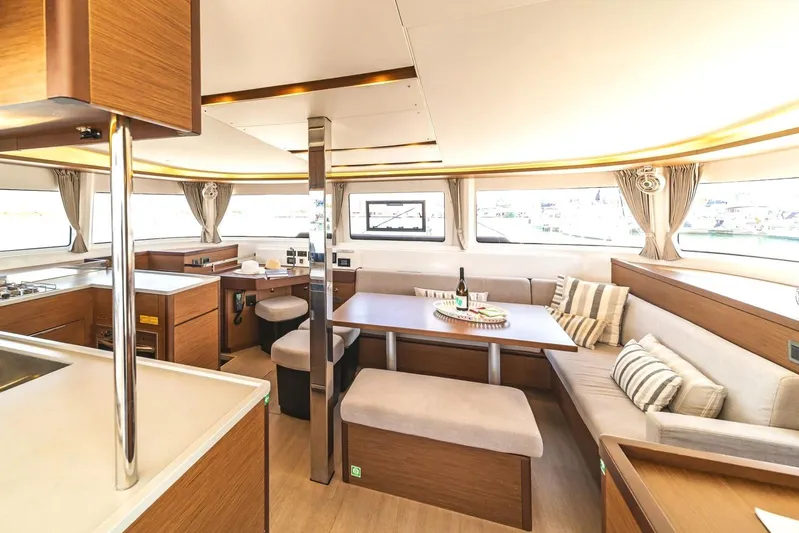  Yacht Photos Pics Luxurious interior of 2021 Lagoon 46 catamaran with modern kitchen and dining area.