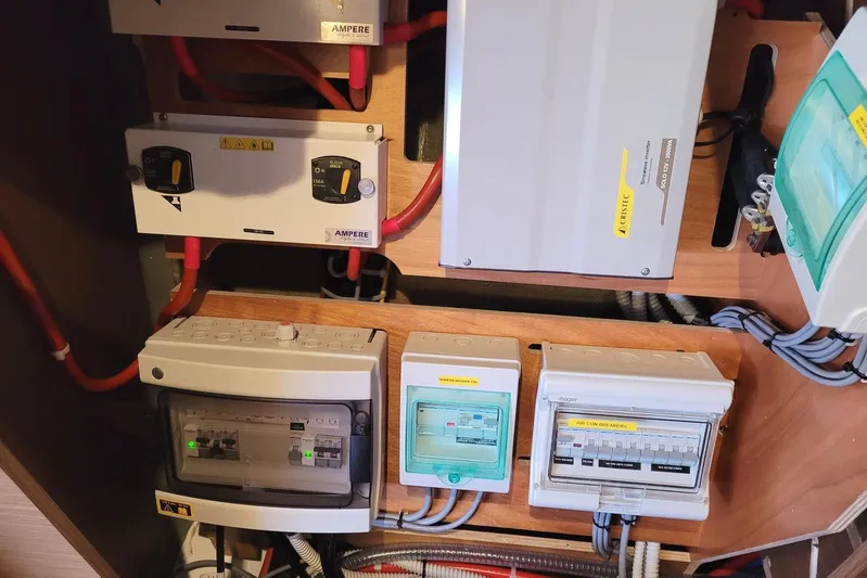  Yacht Photos Pics Electrical panel setup in a 2021 Lagoon 46 yacht, featuring various switches and wiring.
