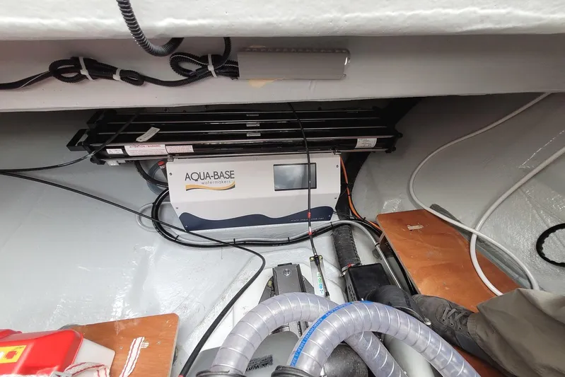  Yacht Photos Pics Aqua-Base watermaker system in 2021 Lagoon 46 yacht interior, featuring cables and equipment.