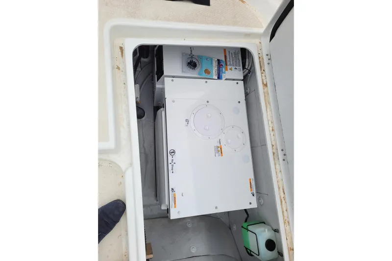  Yacht Photos Pics Engine compartment of a 2021 Lagoon 46 catamaran, showcasing mechanical components.