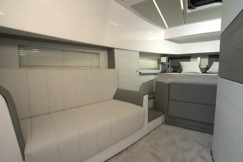  Yacht Photos Pics Modern interior of Nassima Yacht N40, 2025 model, featuring a cozy seating area and a luxurious bed.