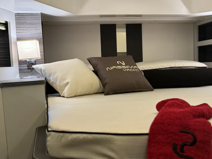  Yacht Photos Pics Luxurious bedroom interior of Nassima Yacht N40, 2025 model, featuring elegant bedding and modern design.