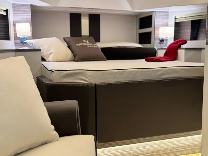  Yacht Photos Pics Luxurious bedroom interior of Nassima Yacht N40, 2025 model, featuring modern design and cozy furnishings.