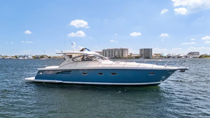 Cerulean Yacht Photos Pics 2000 Tiara Yachts 52 Express Cruiser on water, clear sky background.