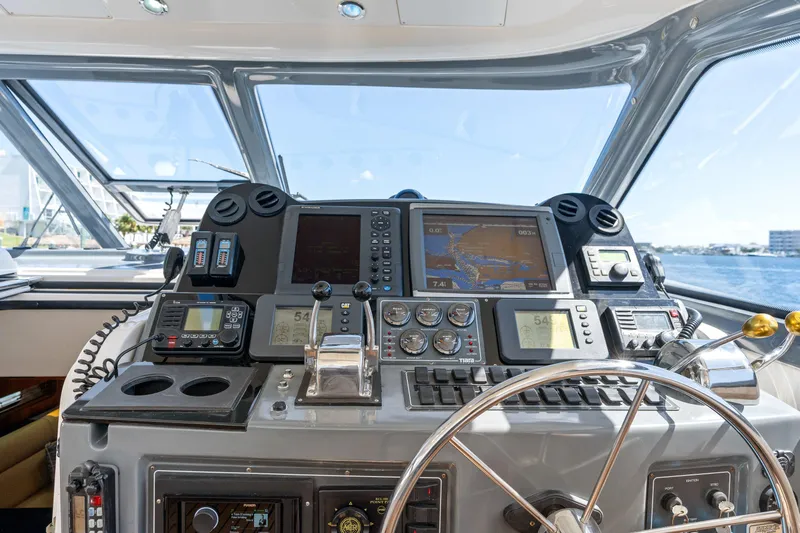 Cerulean Yacht Photos Pics Control panel of 2000 Tiara Yachts 52 Express Cruiser with navigation equipment.
