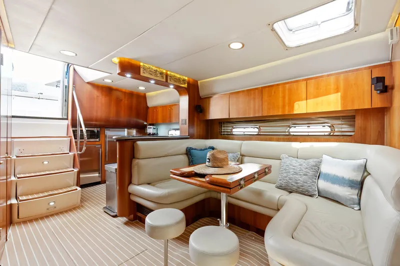 Cerulean Yacht Photos Pics Luxurious interior of 2000 Tiara Yachts 52 Express Cruiser with elegant seating and wood finishes.