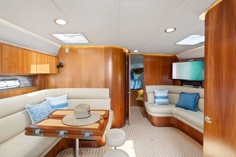 Cerulean Yacht Photos Pics Luxurious interior of 2000 Tiara Yachts 52 Express Cruiser with elegant seating and wooden finishes.