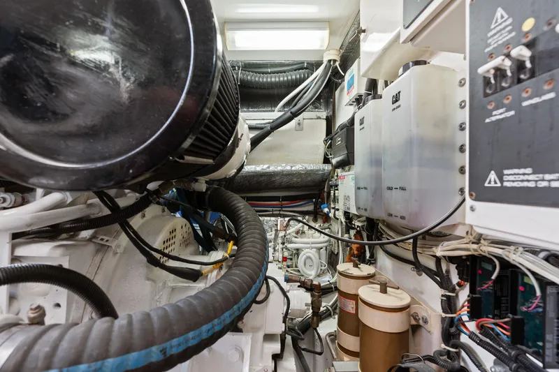 Cerulean Yacht Photos Pics Engine room of 2000 Tiara Yachts 52 Express Cruiser, showcasing complex machinery and components.