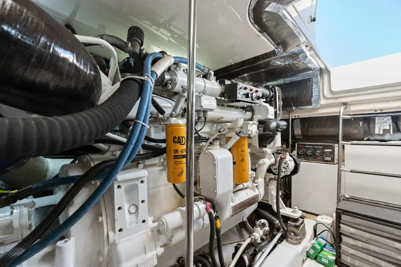 Cerulean Yacht Photos Pics Engine room of 2000 Tiara Yachts 52 Express Cruiser, showcasing mechanical components and filters.