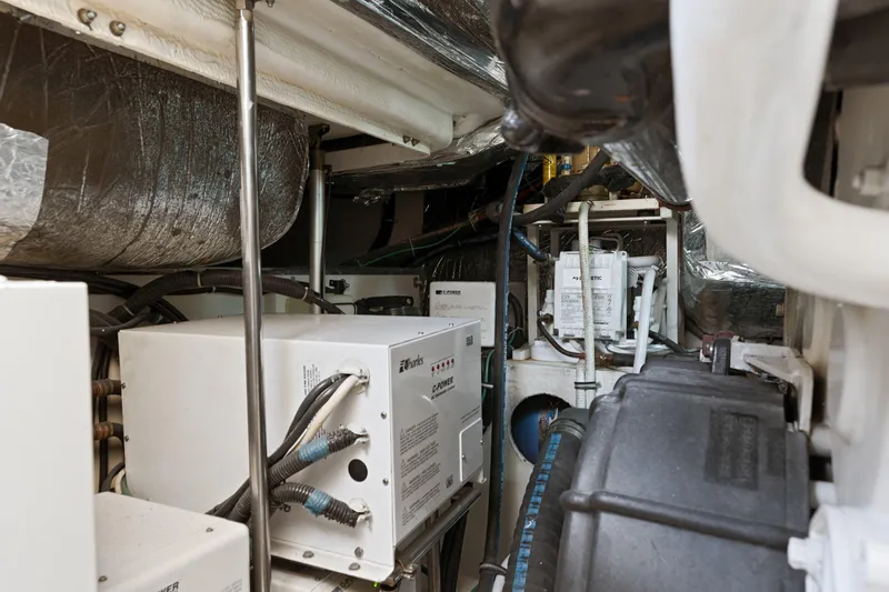 Cerulean Yacht Photos Pics Engine room of 2000 Tiara Yachts 52 Express Cruiser, showcasing mechanical components and wiring.