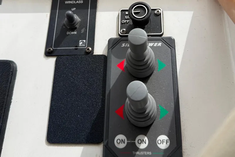 Gabbiano Yacht Photos Pics Boat control panel with thruster joysticks and windlass switch, Navigator 53, 2000 model.