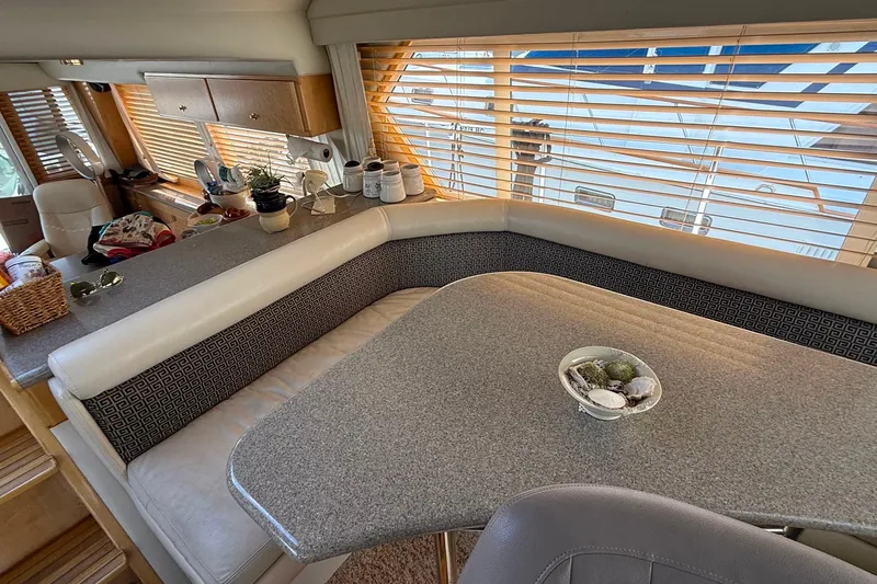 Gabbiano Yacht Photos Pics Interior of 2000 Navigator 53 yacht with cozy seating and decorative elements.