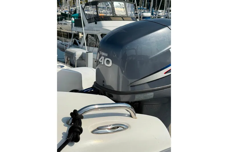 Gabbiano Yacht Photos Pics Yamaha 40 outboard motor on 2000 Navigator 53 boat, docked in marina.