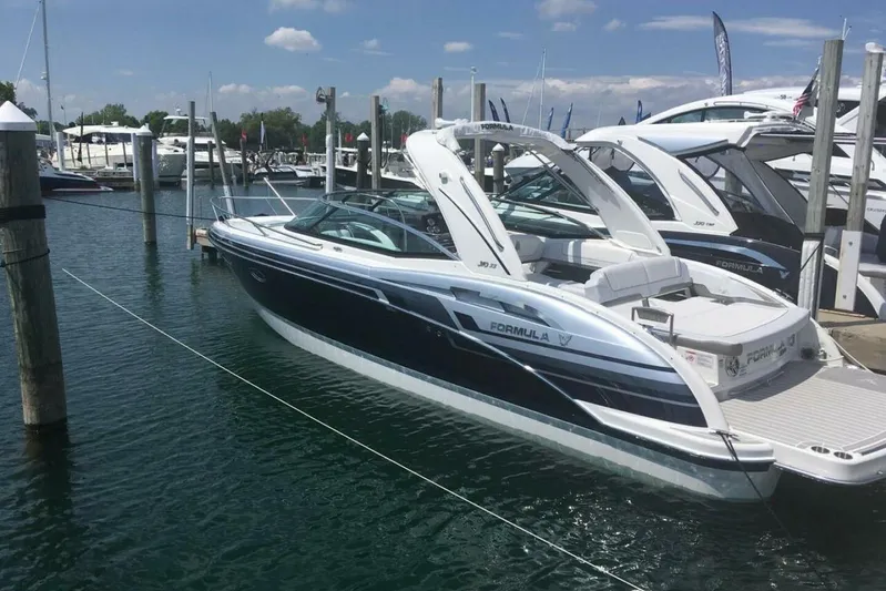  Yacht Photos Pics 2020 Formula 310SS boat docked at marina under clear blue sky.