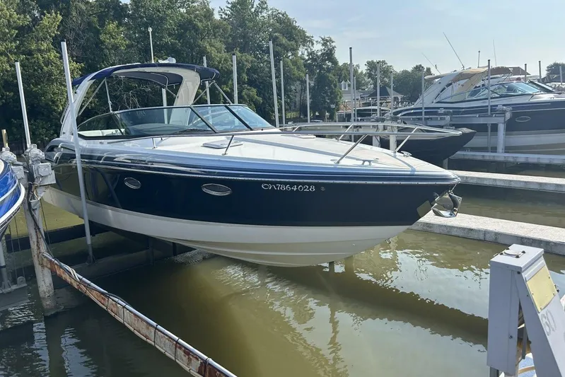  Yacht Photos Pics 2020 Formula 310SS boat docked in marina, surrounded by other vessels.