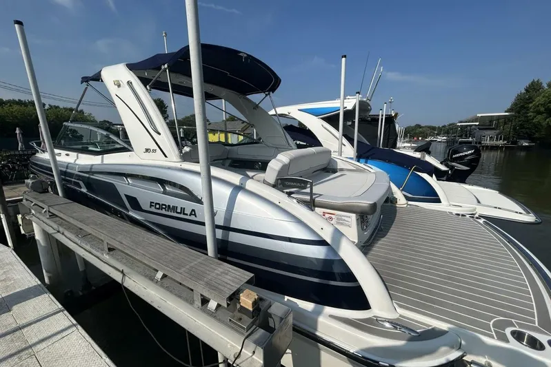  Yacht Photos Pics 2020 Formula 310SS boat docked, featuring sleek design and modern amenities.