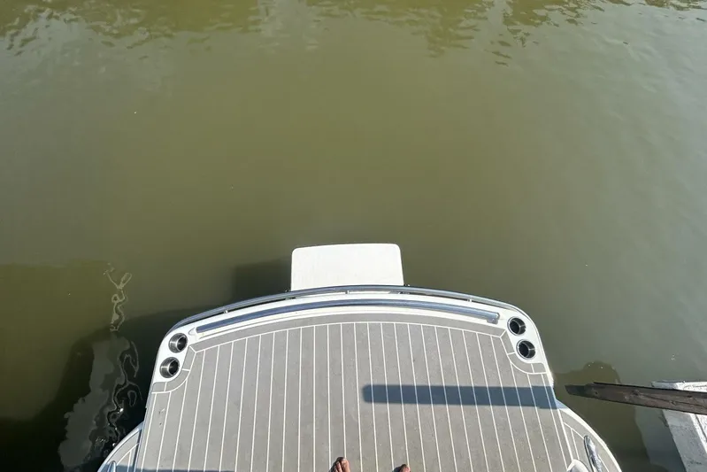  Yacht Photos Pics Rear view of 2020 Formula 310SS boat deck over calm water.