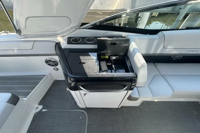  Yacht Photos Pics 2020 Formula 310SS boat interior with seating and built-in storage.