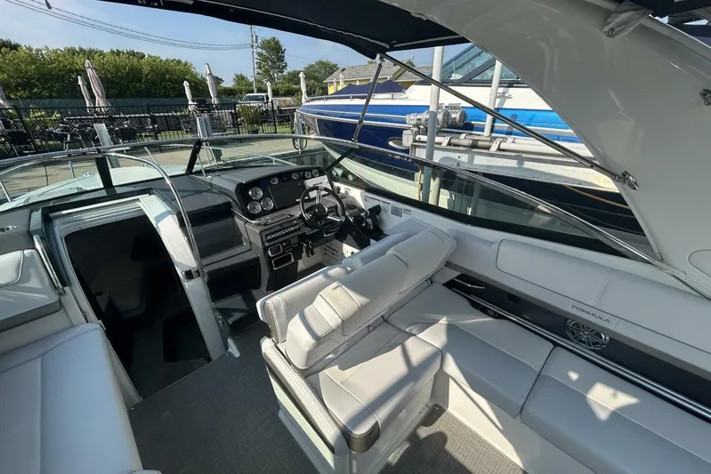  Yacht Photos Pics 2020 Formula 310SS boat interior with modern dashboard and seating.