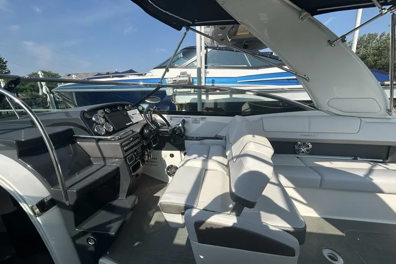  Yacht Photos Pics 2020 Formula 310SS boat interior with modern dashboard and seating.