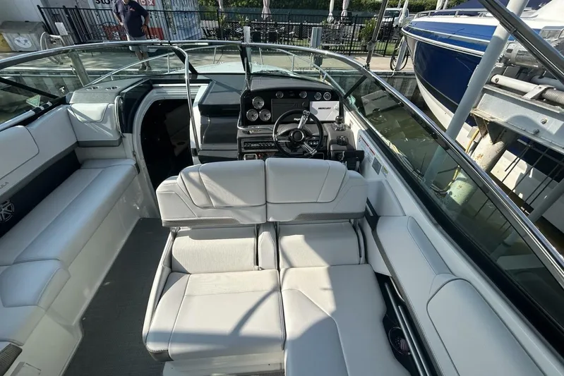  Yacht Photos Pics 2020 Formula 310SS boat interior with luxurious seating and modern dashboard.