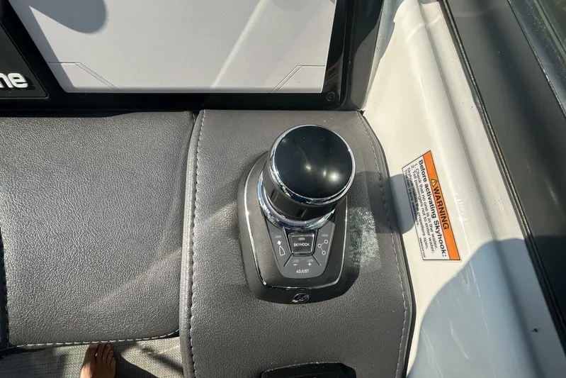  Yacht Photos Pics Control panel of a 2020 Formula 310SS boat with joystick and warning label.