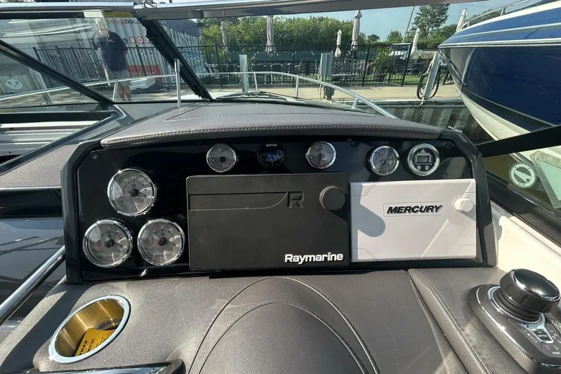  Yacht Photos Pics Dashboard of a 2020 Formula 310SS boat with Raymarine and Mercury controls.