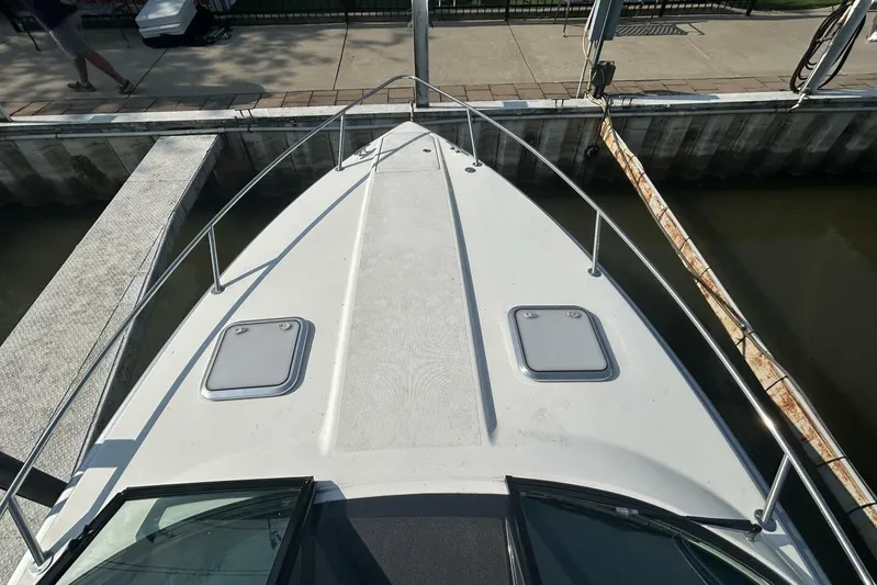  Yacht Photos Pics 2020 Formula 310SS boat docked, showing bow deck and hatches.