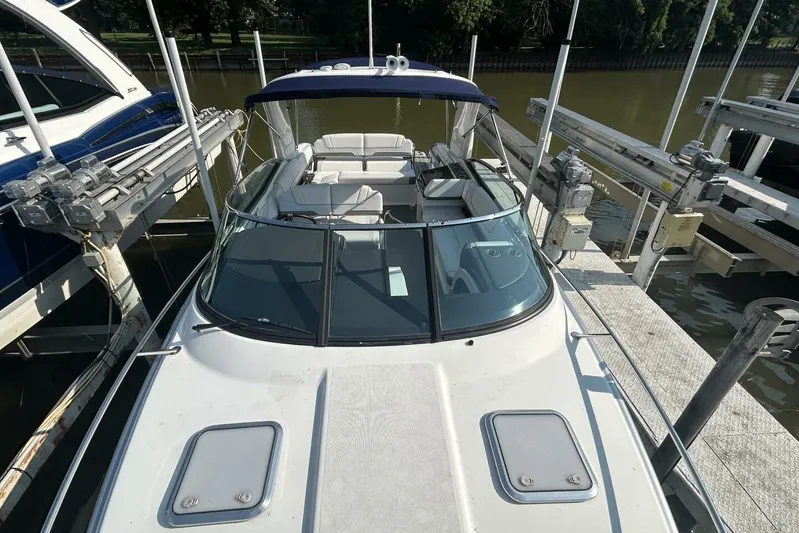  Yacht Photos Pics 2020 Formula 310SS boat docked, featuring sleek design and spacious seating.