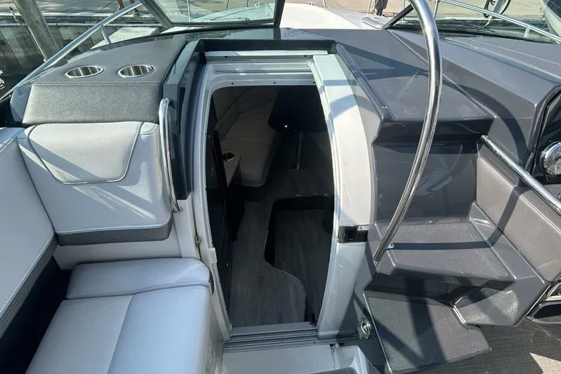  Yacht Photos Pics 2020 Formula 310SS boat interior with cabin entrance and seating area.